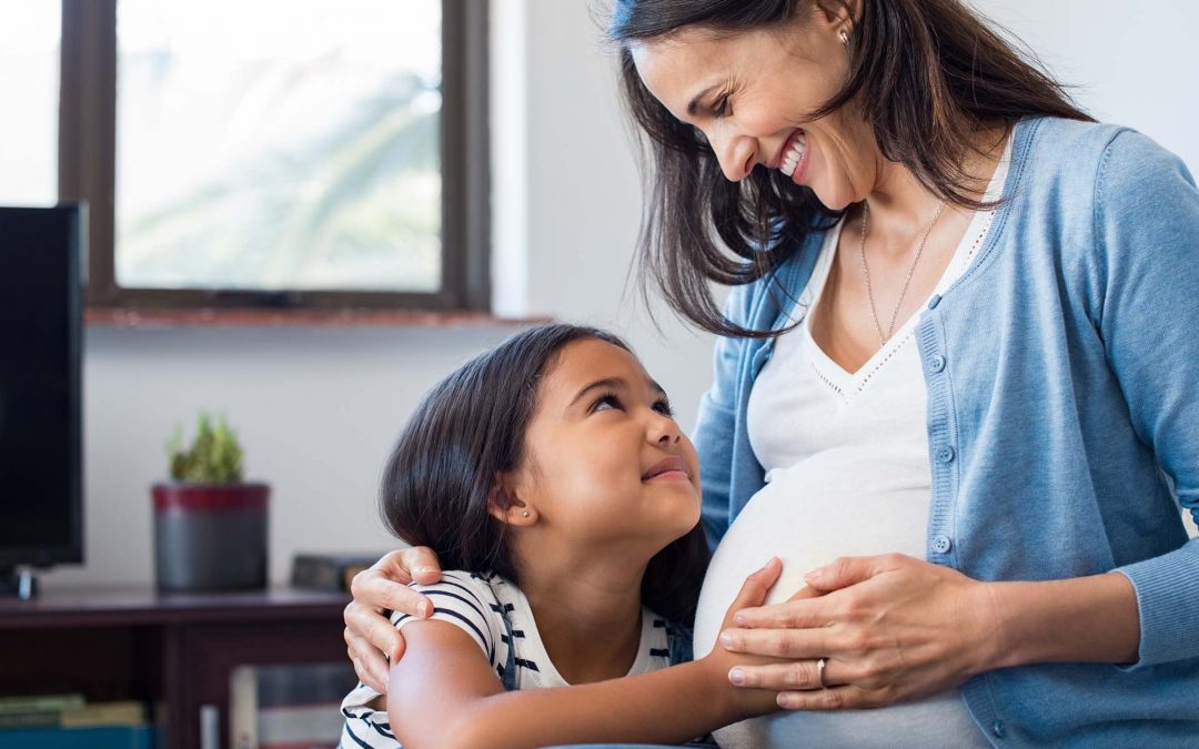 Pregnant Woman Chiropractor's Office